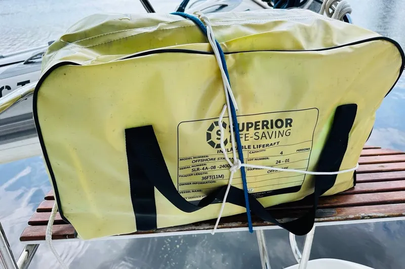 Free Range Yacht Photos Pics Yellow inflatable liferaft bag on a 2005 Hunter 44 sailboat deck.