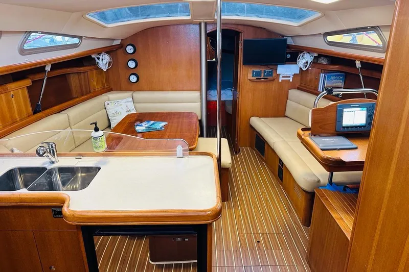 Free Range Yacht Photos Pics Interior of 2005 Hunter 44 sailboat with wood finish and modern amenities.