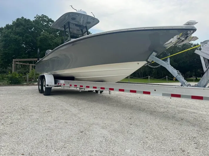  Yacht Photos Pics 2021 ShearWater 270 Carolina Flare boat on trailer, parked outdoors.