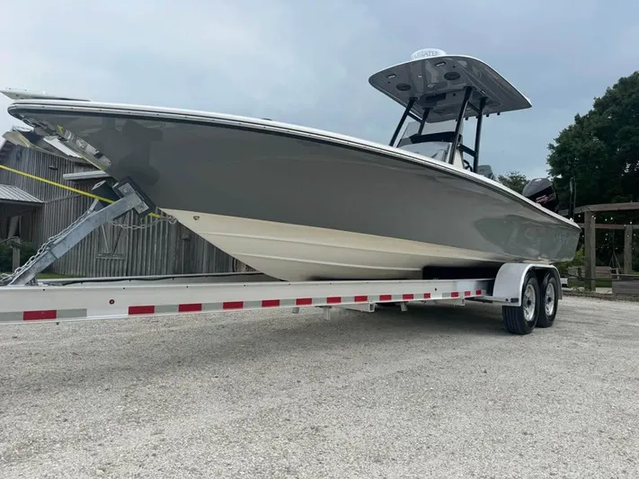  Yacht Photos Pics 2021 ShearWater 270 Carolina Flare boat on trailer, parked outdoors.