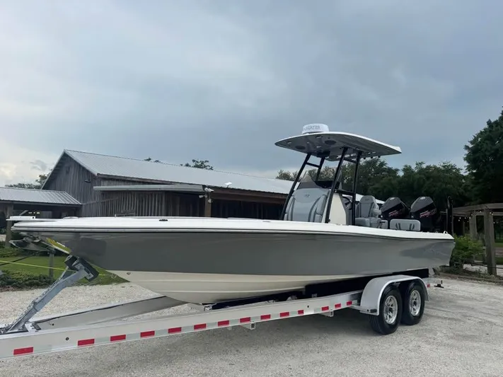  Yacht Photos Pics 2021 ShearWater 270 Carolina Flare boat on trailer, parked outdoors.