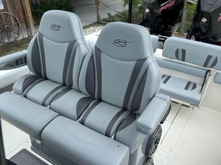  Yacht Photos Pics 2021 ShearWater 270 Carolina Flare boat seats, gray leather, dual motors in background.