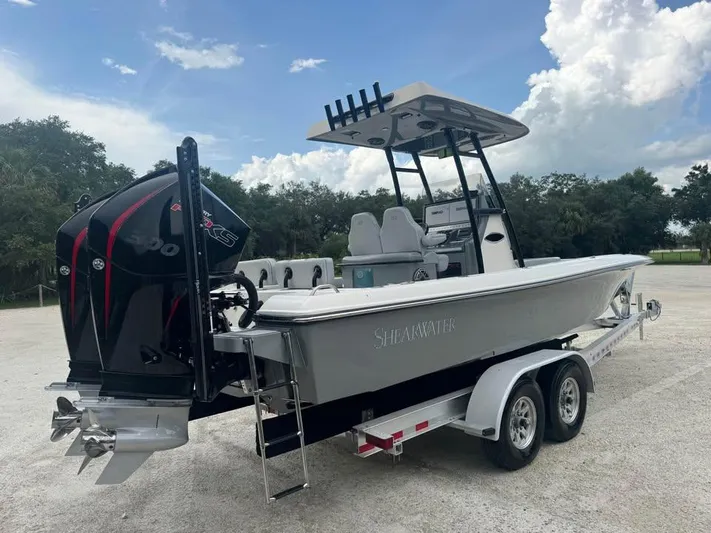  Yacht Photos Pics 2021 ShearWater 270 Carolina Flare boat on trailer, featuring powerful outboard motor.