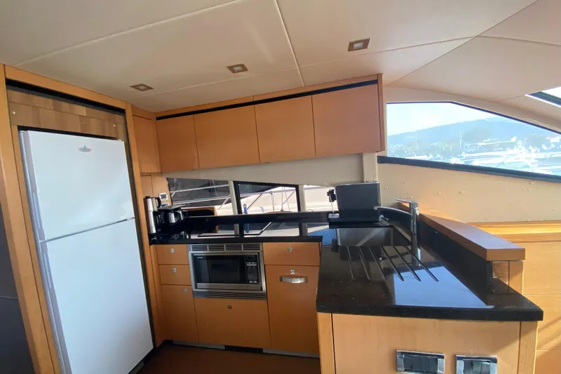 Nm01655 Yacht Photos Pics Luxurious kitchen interior of 2011 Sunseeker Manhattan 63 yacht with modern appliances.