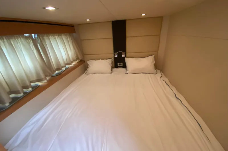 Nm01655 Yacht Photos Pics Luxurious bedroom interior of 2011 Sunseeker Manhattan 63 yacht with cozy bedding.
