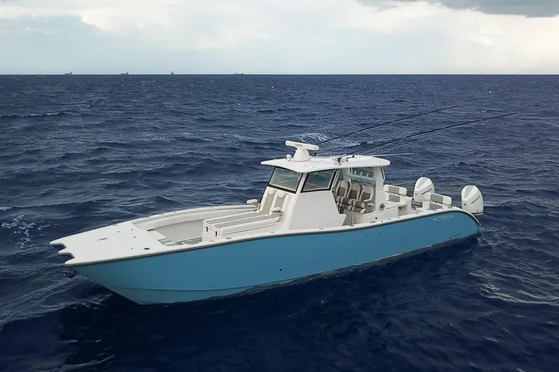  Yacht Photos Pics 2022 Insetta 35IFC boat on open ocean, featuring sleek design and dual outboard motors.