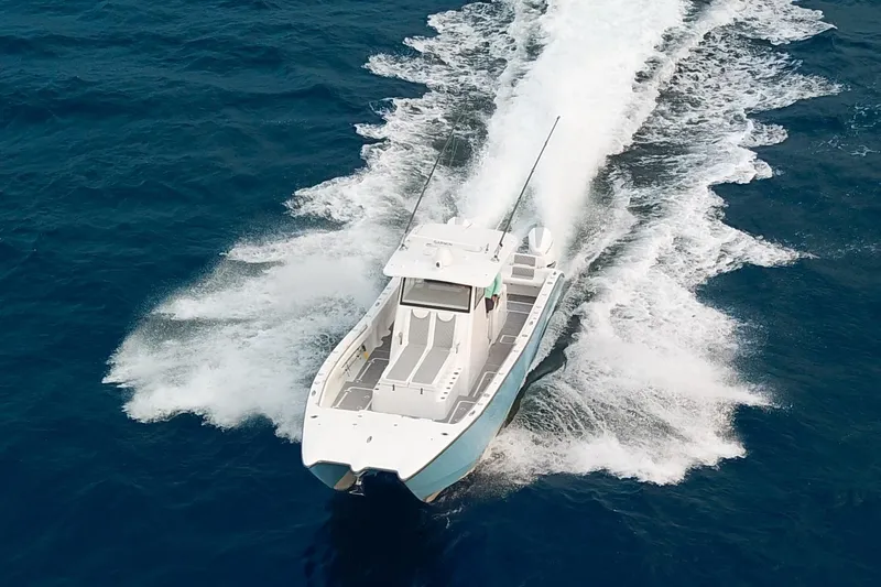  Yacht Photos Pics 2022 Insetta 35IFC boat cruising on open blue ocean waters.