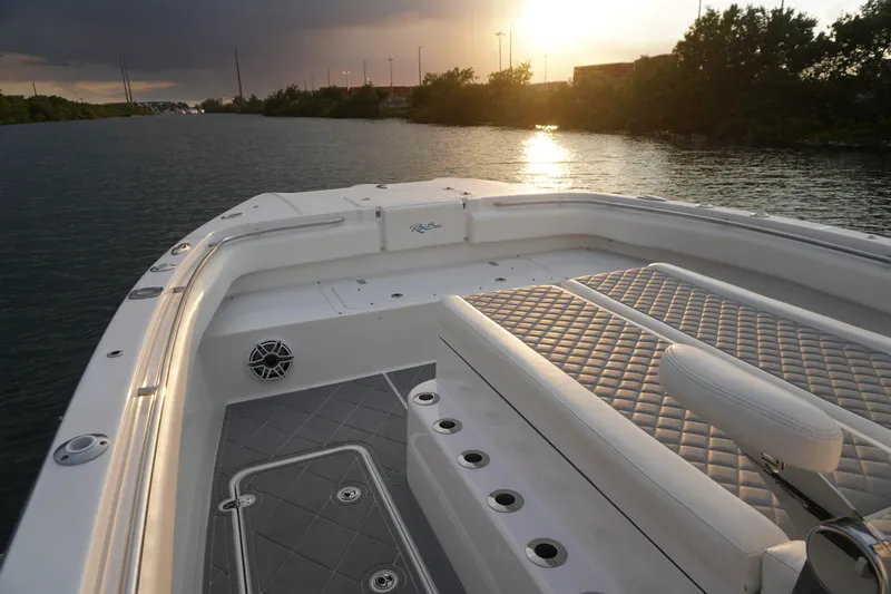  Yacht Photos Pics 2022 Insetta 35IFC boat interior at sunset on a calm waterway.