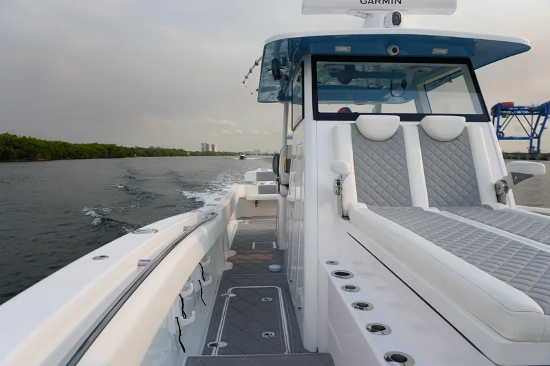  Yacht Photos Pics 2022 Insetta 35IFC boat cruising on water, featuring sleek design and comfortable seating.