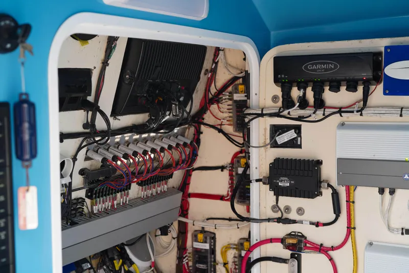  Yacht Photos Pics Electrical system inside a 2022 Insetta 35IFC boat, featuring Garmin equipment and organized wiring.