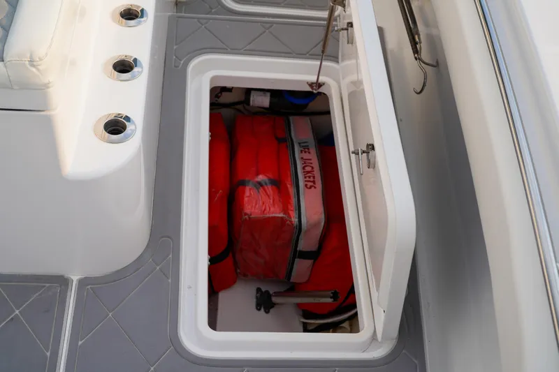  Yacht Photos Pics Storage compartment on 2022 Insetta 35IFC boat with life jackets and equipment.