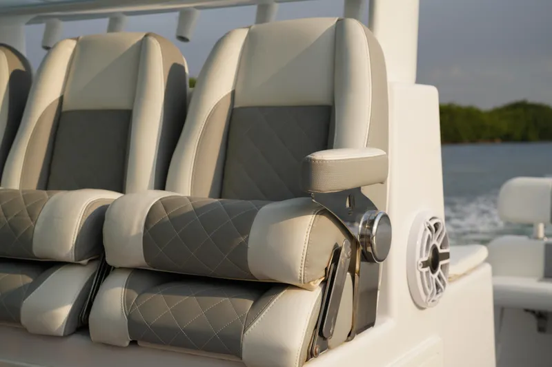  Yacht Photos Pics Luxury seating on 2022 Insetta 35IFC boat with quilted upholstery and armrest.