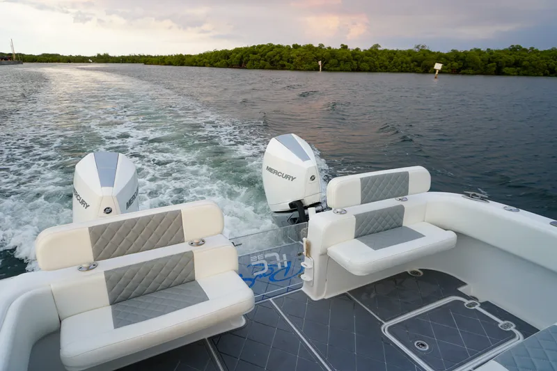  Yacht Photos Pics 2022 Insetta 35IFC boat with dual Mercury engines cruising on open water.