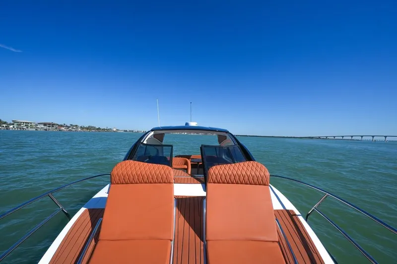Custom Order Yours Today! Yacht Photos Pics 2025 Hanover 355 Outboard boat on water, featuring luxurious deck seating.