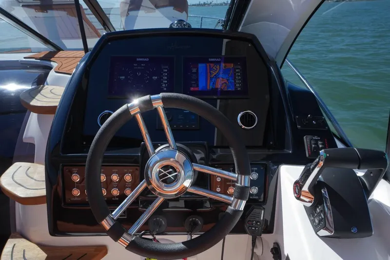 Custom Order Yours Today! Yacht Photos Pics Steering console of 2025 Hanover 355 Outboard boat with modern controls and displays.