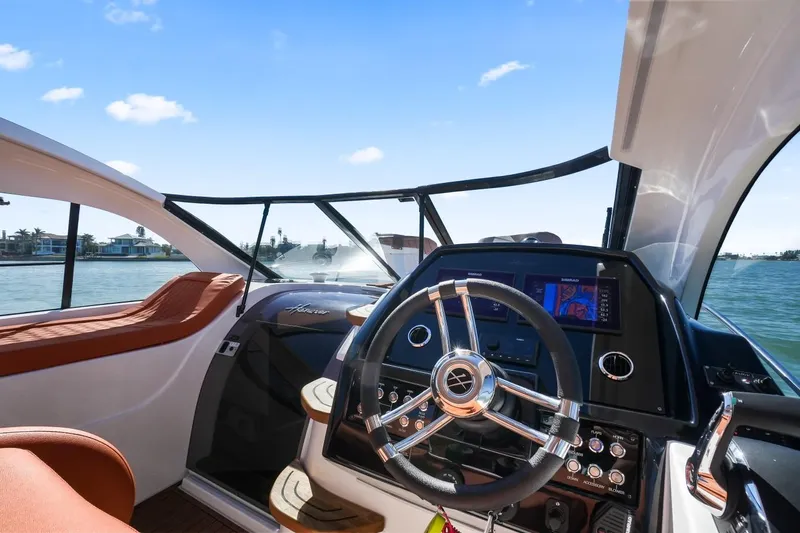 Custom Order Yours Today! Yacht Photos Pics 2025 Hanover 355 Outboard boat interior with modern steering and navigation system.