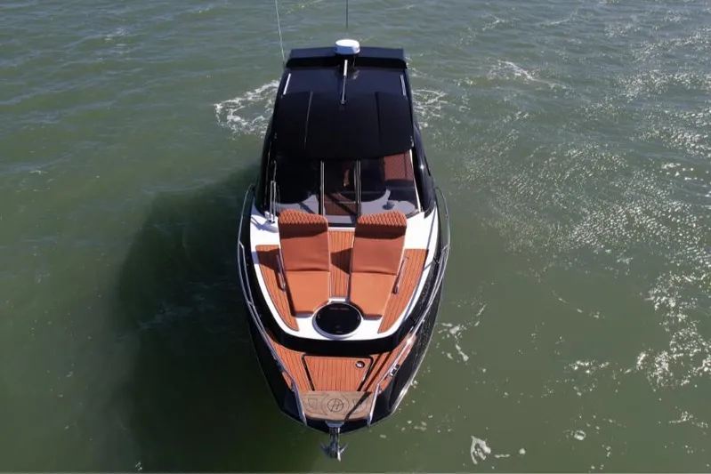 Custom Order Yours Today! Yacht Photos Pics 2025 Hanover 355 Outboard boat on water, aerial view, sleek design.