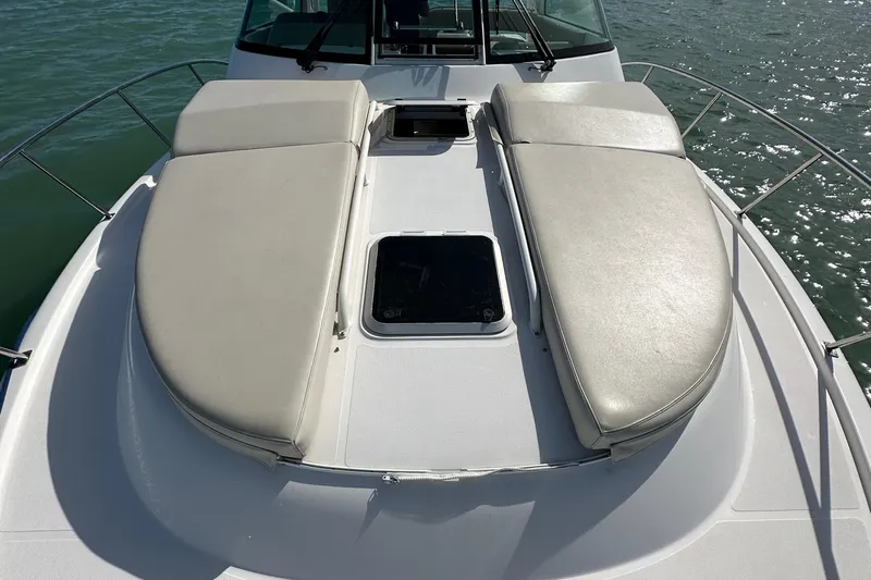  Yacht Photos Pics 2016 Pursuit OS 385 Offshore boat with cushioned deck seating on calm water.