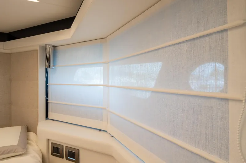 Curly Yacht Photos Pics Interior of 2021 Cranchi E52S yacht with elegant window blinds and modern design.