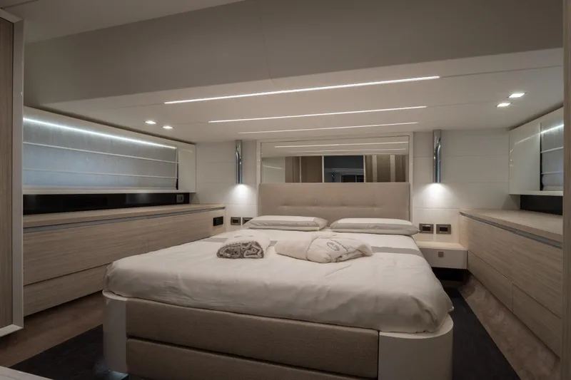Curly Yacht Photos Pics Luxurious 2021 Cranchi E52S yacht bedroom with modern design and ambient lighting.