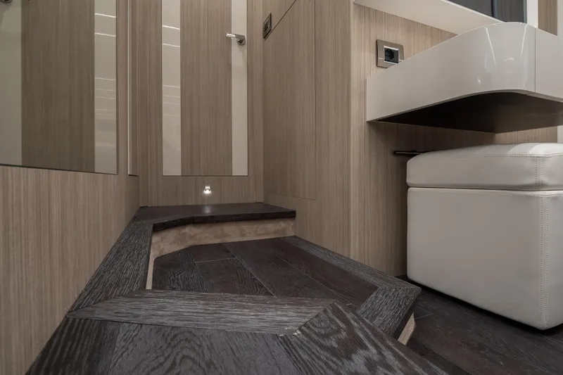 Curly Yacht Photos Pics Luxurious interior of 2021 Cranchi E52S yacht with modern wood and leather finishes.