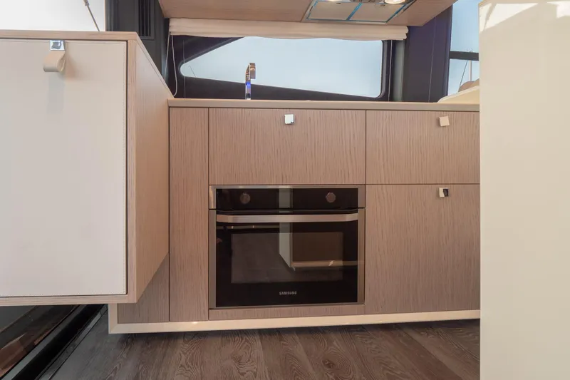 Curly Yacht Photos Pics Modern kitchen interior of 2021 Cranchi E52S yacht with built-in Samsung oven.