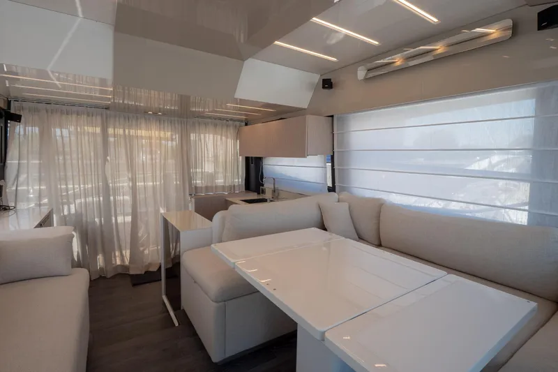 Curly Yacht Photos Pics Luxurious interior of 2021 Cranchi E52S yacht with modern furnishings and elegant design.