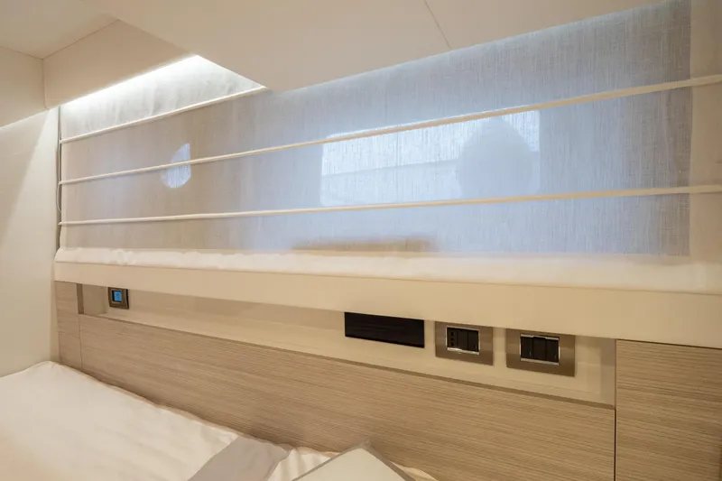 Curly Yacht Photos Pics Interior of 2021 Cranchi E52S yacht cabin with modern design and soft lighting.