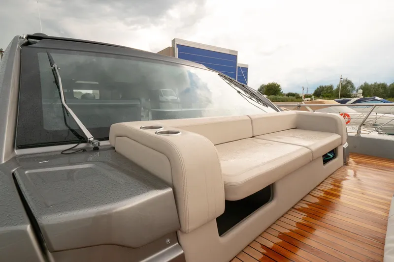 Curly Yacht Photos Pics 2021 Cranchi E52S yacht with sleek design and comfortable seating on deck.