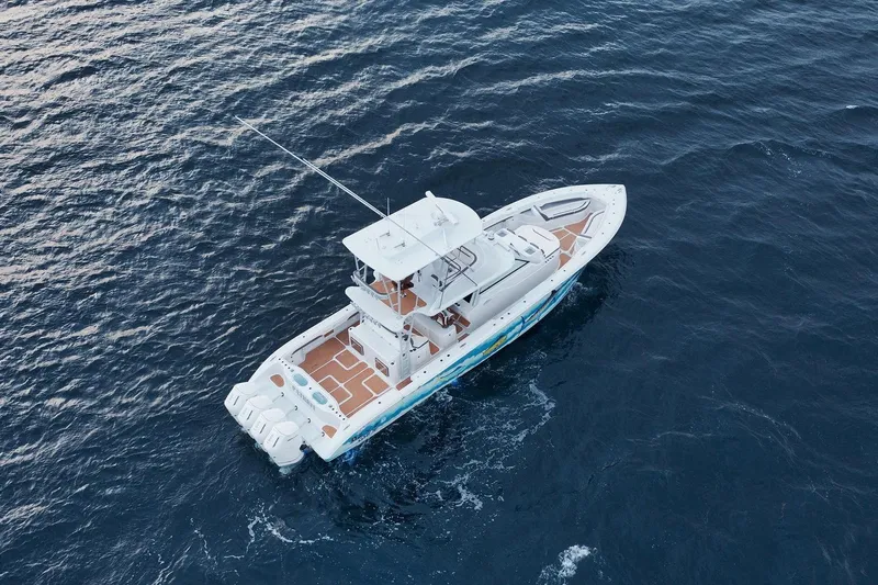  Yacht Photos Pics 2022 Yellowfin 54 Offshore boat cruising on open ocean waters.