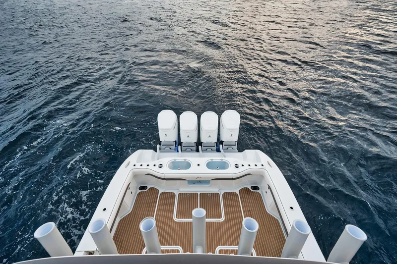  Yacht Photos Pics 2022 Yellowfin 54 Offshore boat with quad engines on open water.