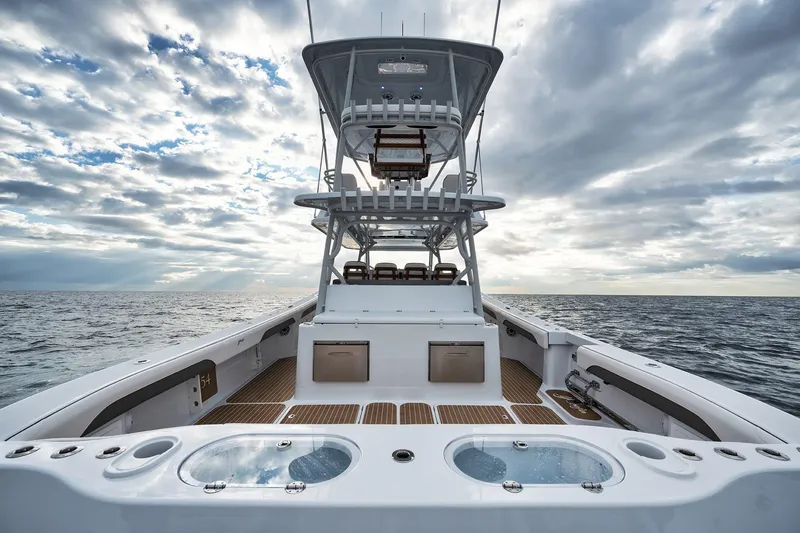  Yacht Photos Pics 2022 Yellowfin 54 Offshore boat on open sea under cloudy sky.
