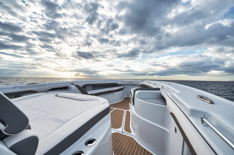  Yacht Photos Pics 2022 Yellowfin 54 Offshore boat deck with ocean view and dramatic cloudy sky.