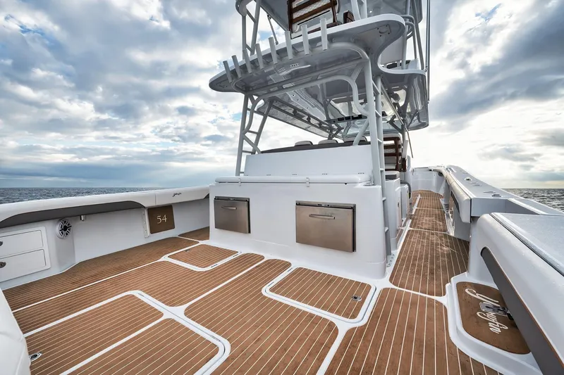  Yacht Photos Pics 2022 Yellowfin 54 Offshore boat deck with sleek design and ocean backdrop.