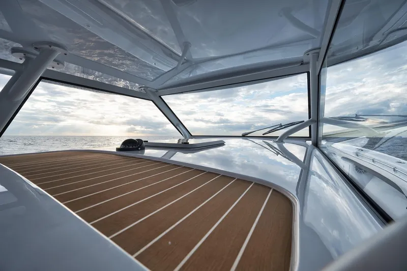  Yacht Photos Pics 2022 Yellowfin 54 Offshore boat with sleek deck and ocean view.