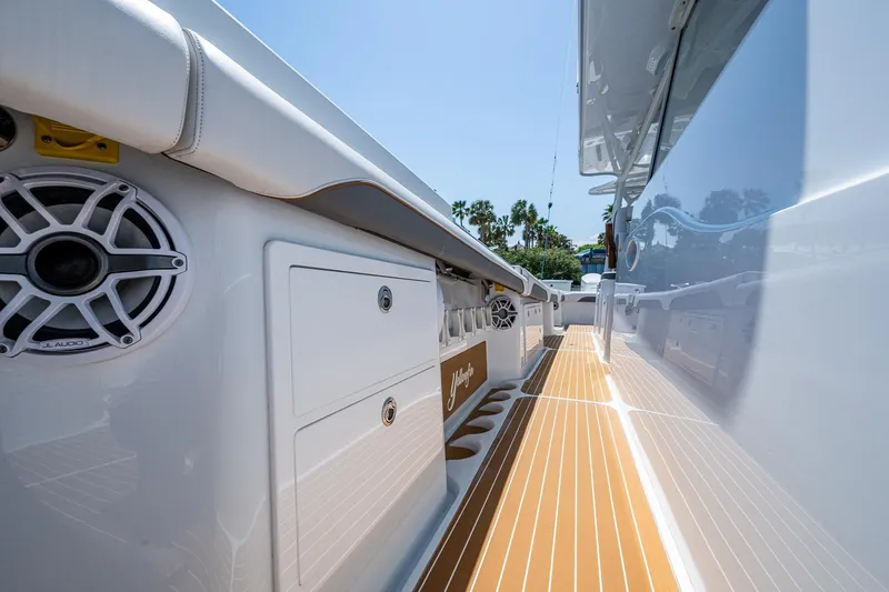  Yacht Photos Pics 2022 Yellowfin 54 Offshore boat deck with JL Audio speakers and sleek design.