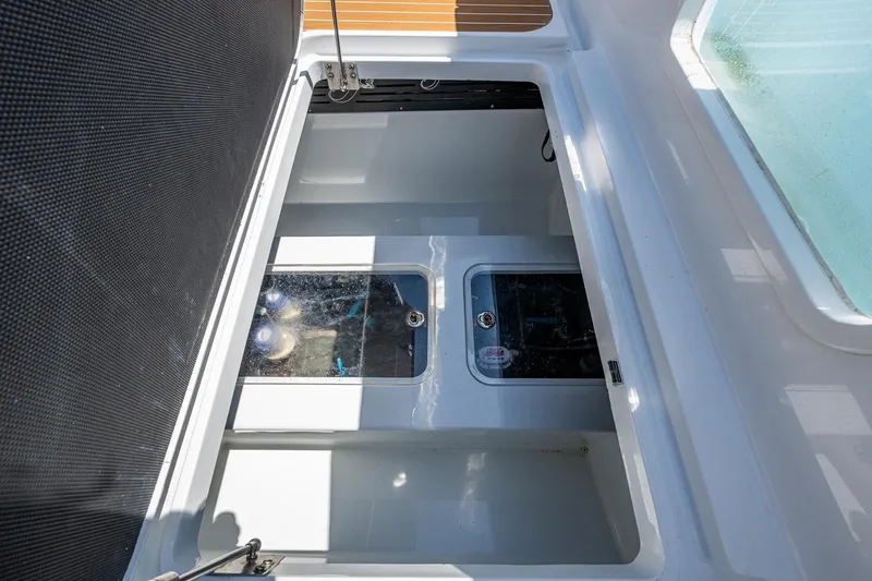  Yacht Photos Pics Open storage compartment on 2022 Yellowfin 54 Offshore boat, showcasing interior details.