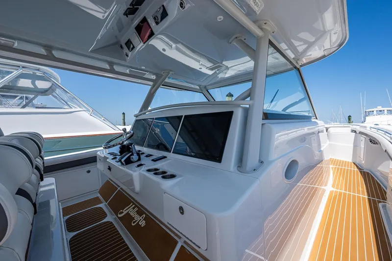  Yacht Photos Pics 2022 Yellowfin 54 Offshore boat interior with sleek design and modern controls.