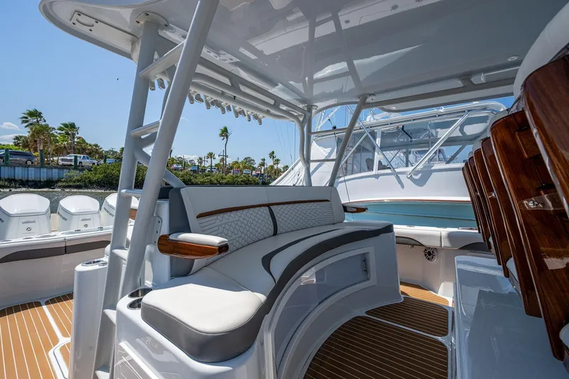 Yacht Photos Pics 2022 Yellowfin 54 Offshore boat interior with luxurious seating and sleek design.