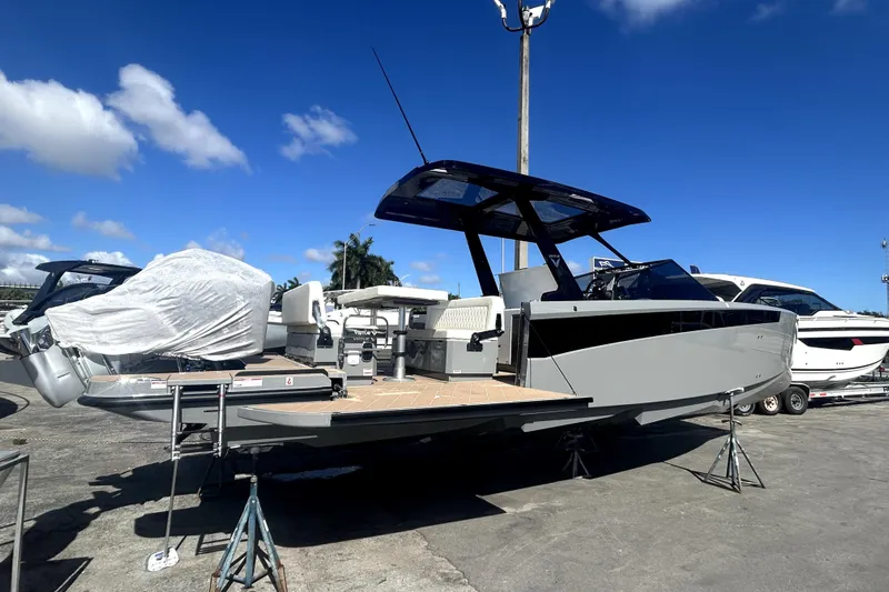 Virtue Yacht Photos Pics 2026 Virtue V10 boat displayed outdoors under clear blue sky.