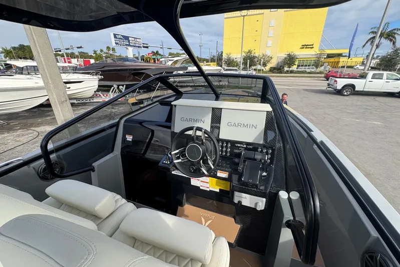 Virtue Yacht Photos Pics Interior of 2026 Virtue V10 boat with Garmin navigation system and steering wheel.