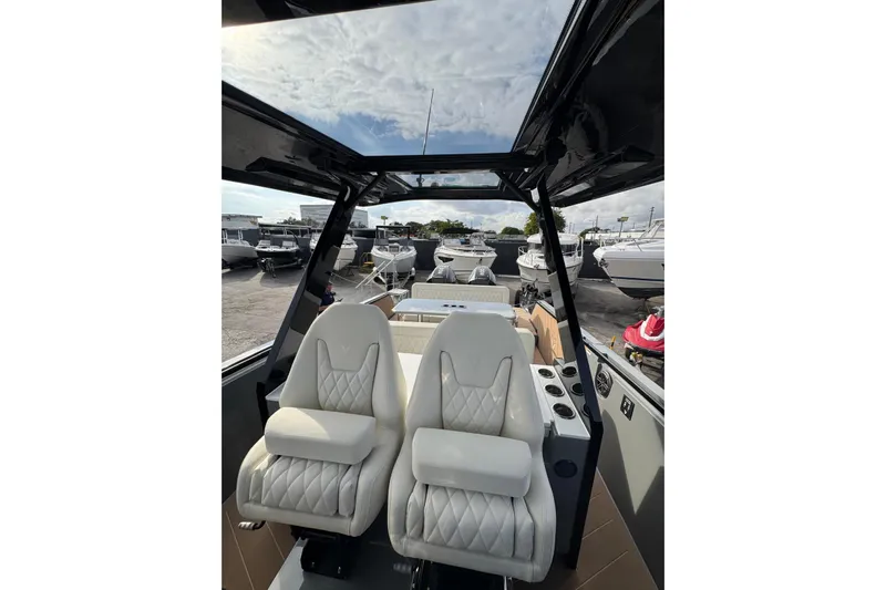 Virtue Yacht Photos Pics Luxurious interior of 2026 Virtue V10 boat with plush seating and panoramic views.