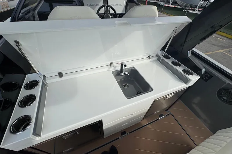 Virtue Yacht Photos Pics 2026 Virtue V10 boat interior with sleek kitchenette and modern sink design.