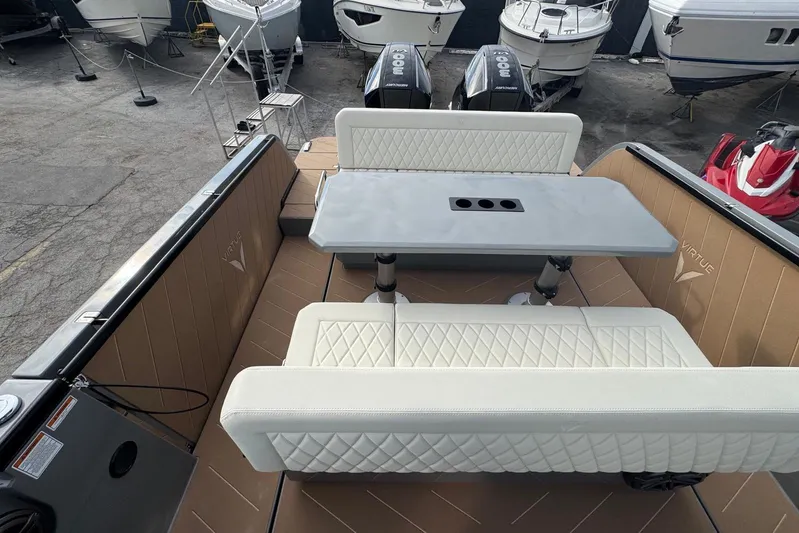 Virtue Yacht Photos Pics Luxurious 2026 Virtue V10 boat interior with elegant seating and table setup.