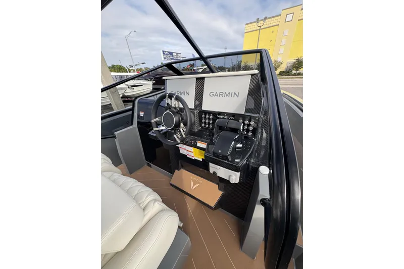 Virtue Yacht Photos Pics 2026 Virtue V10 boat dashboard with Garmin navigation system and leather seating.