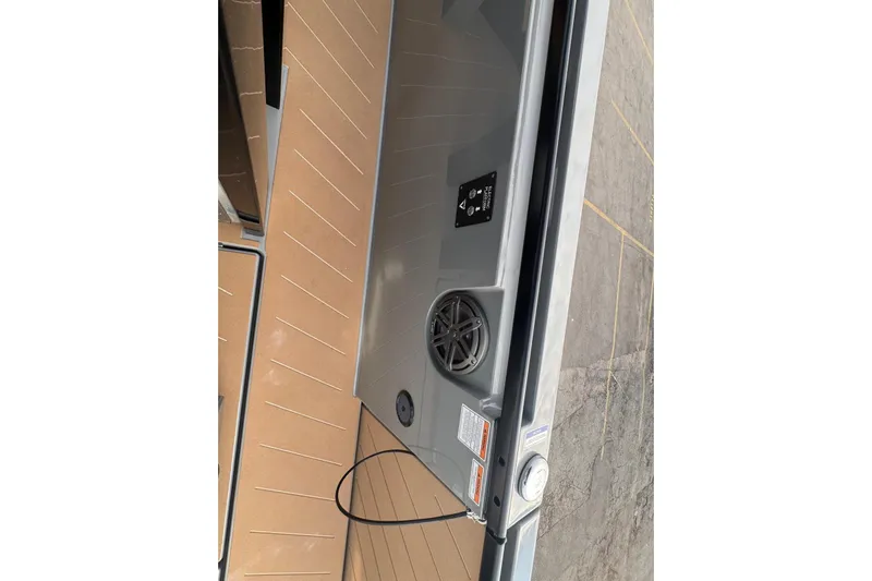 Virtue Yacht Photos Pics Interior view of 2026 Virtue V10 vehicle trunk with speaker and safety labels.