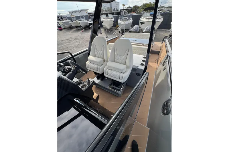 Virtue Yacht Photos Pics Luxury interior of 2026 Virtue V10 boat with white seats and modern design.