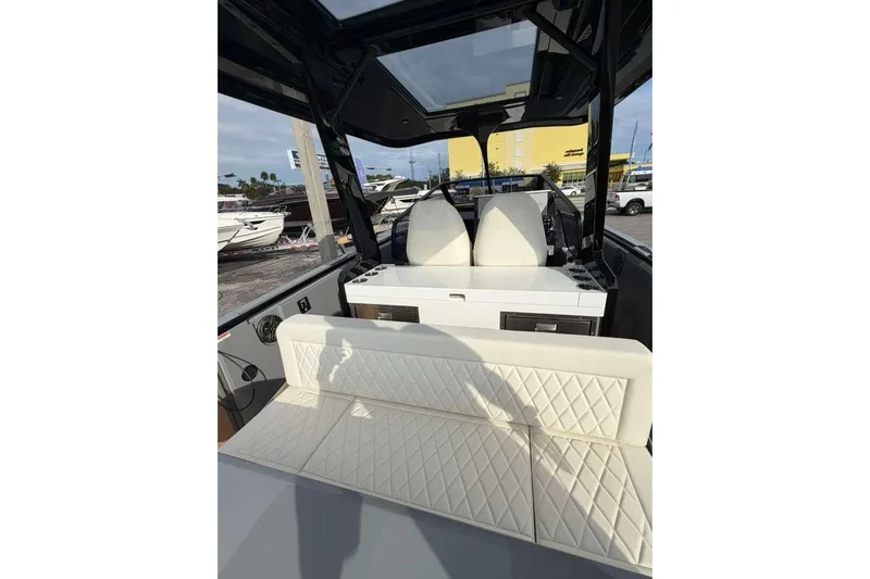 Virtue Yacht Photos Pics Interior of 2026 Virtue V10 boat with white quilted seating and modern design.