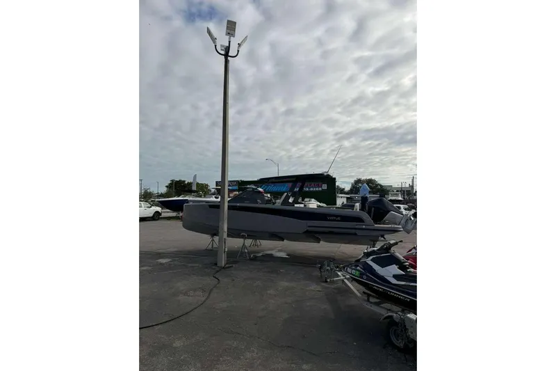 Virtue Yacht Photos Pics 2026 Virtue V10 boat displayed outdoors under cloudy sky.