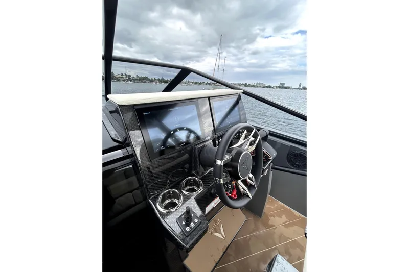 Virtue Yacht Photos Pics Luxurious 2026 Virtue V10 boat dashboard with sleek steering and digital displays.